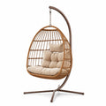 Sedia sospesa in rattan sintetico con cuscini in poliestere beige