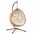 Sedia sospesa in rattan con cuscino in tessuto beige